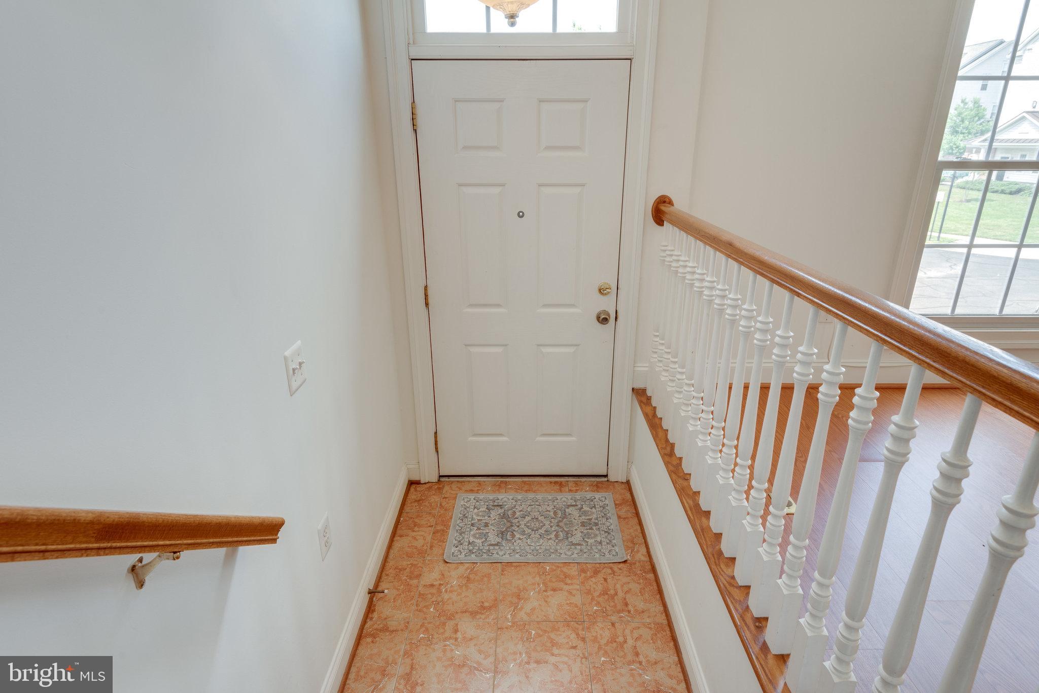 6884 Witton Circle Gainesville, VA 20155 - Photo 7 of 40 a view of front door