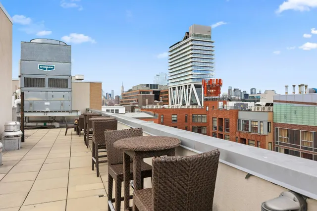 a view of a patio with a table and chairs