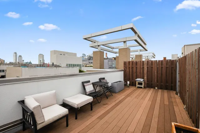 a terrace with a table and chairs