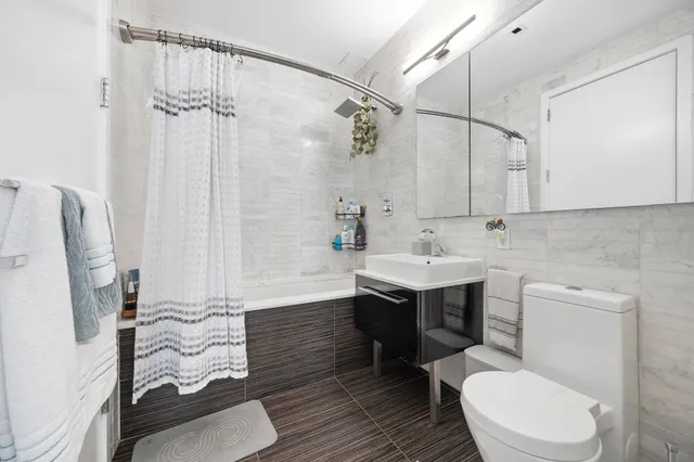 a bedroom with furniture and a wooden floor