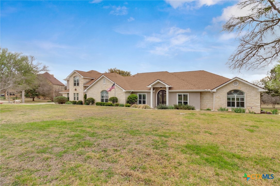 2235 Summit Ridge San Marcos, TX 78666 - Photo 3 of 38 a front view of a house with a yard