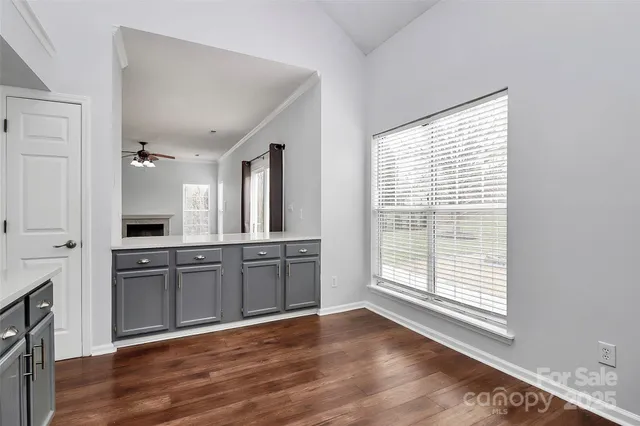 a view of a kitchen with a sink cabinet and a window