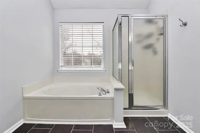 a white bath tub sitting next to a window