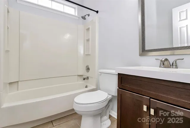 a bathroom with a sink a toilet and a bathtub