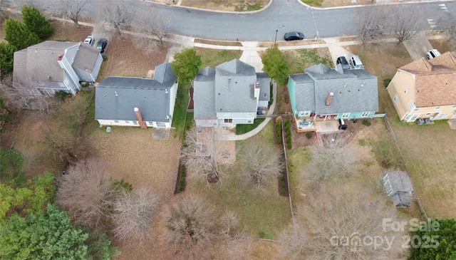 an aerial view of a house with outdoor space