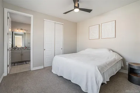 a bedroom with a bed and a view of bathroom