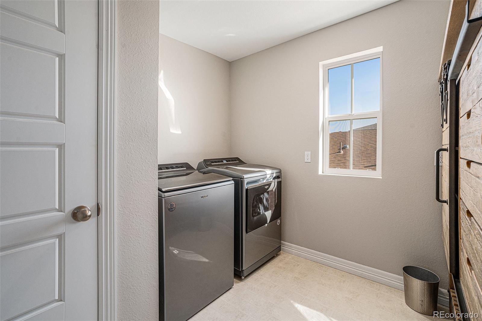 22011 East Stanford Circle Aurora, CO 80015 - Photo 19 of 43 a kitchen with a refrigerator and a stove