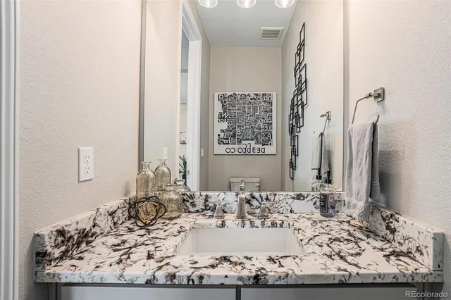 a view of a bathroom with a sink and mirror