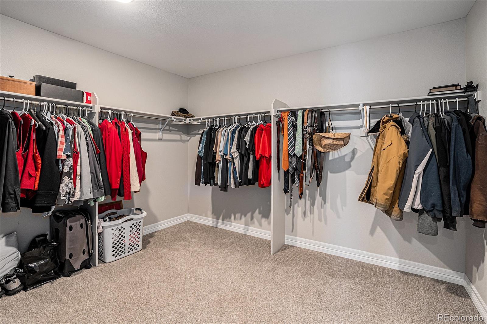 22011 East Stanford Circle Aurora, CO 80015 - Photo 28 of 43 a view of walk in closet with clothes
