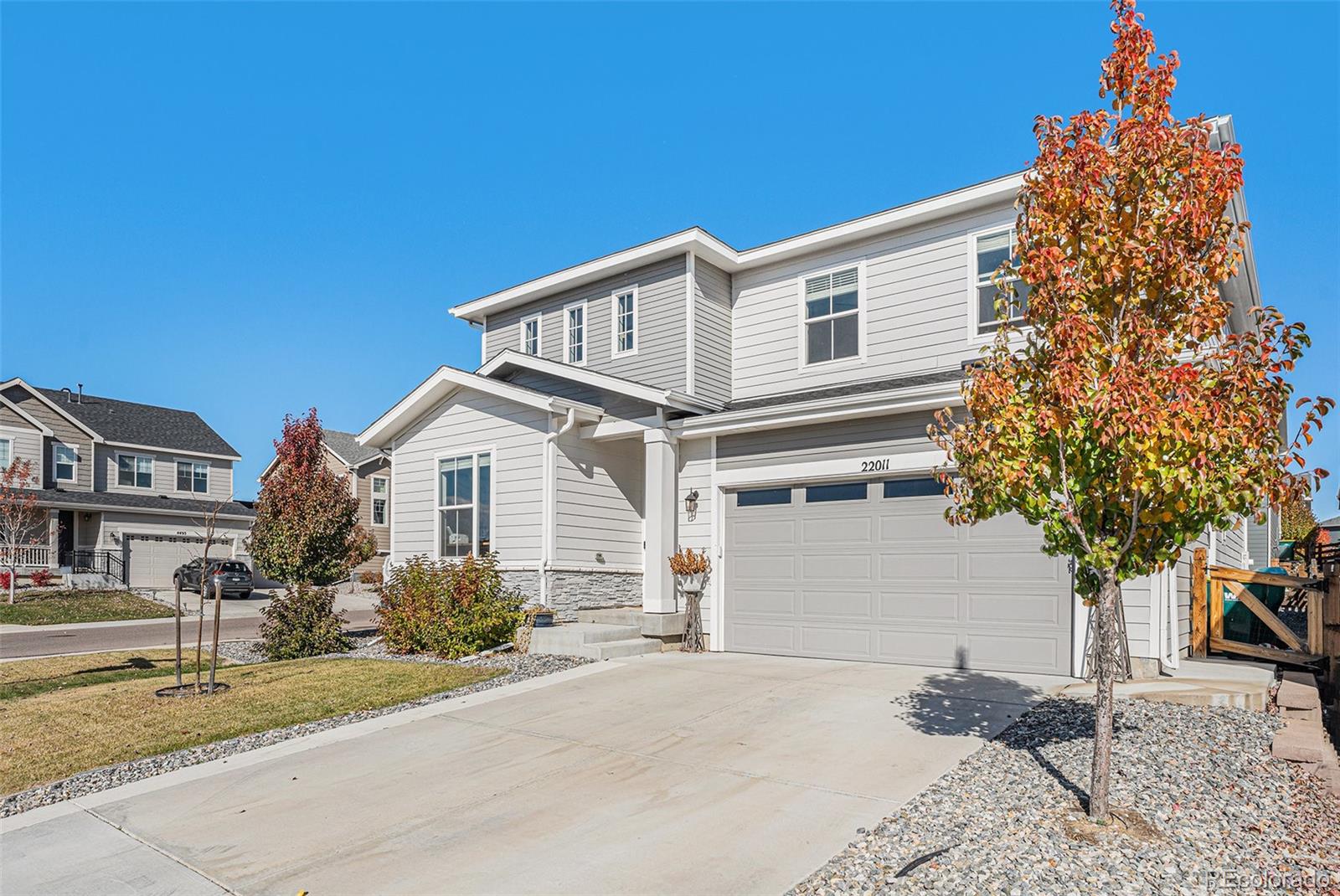 22011 East Stanford Circle Aurora, CO 80015 - Photo 3 of 43 a view of a house with a yard