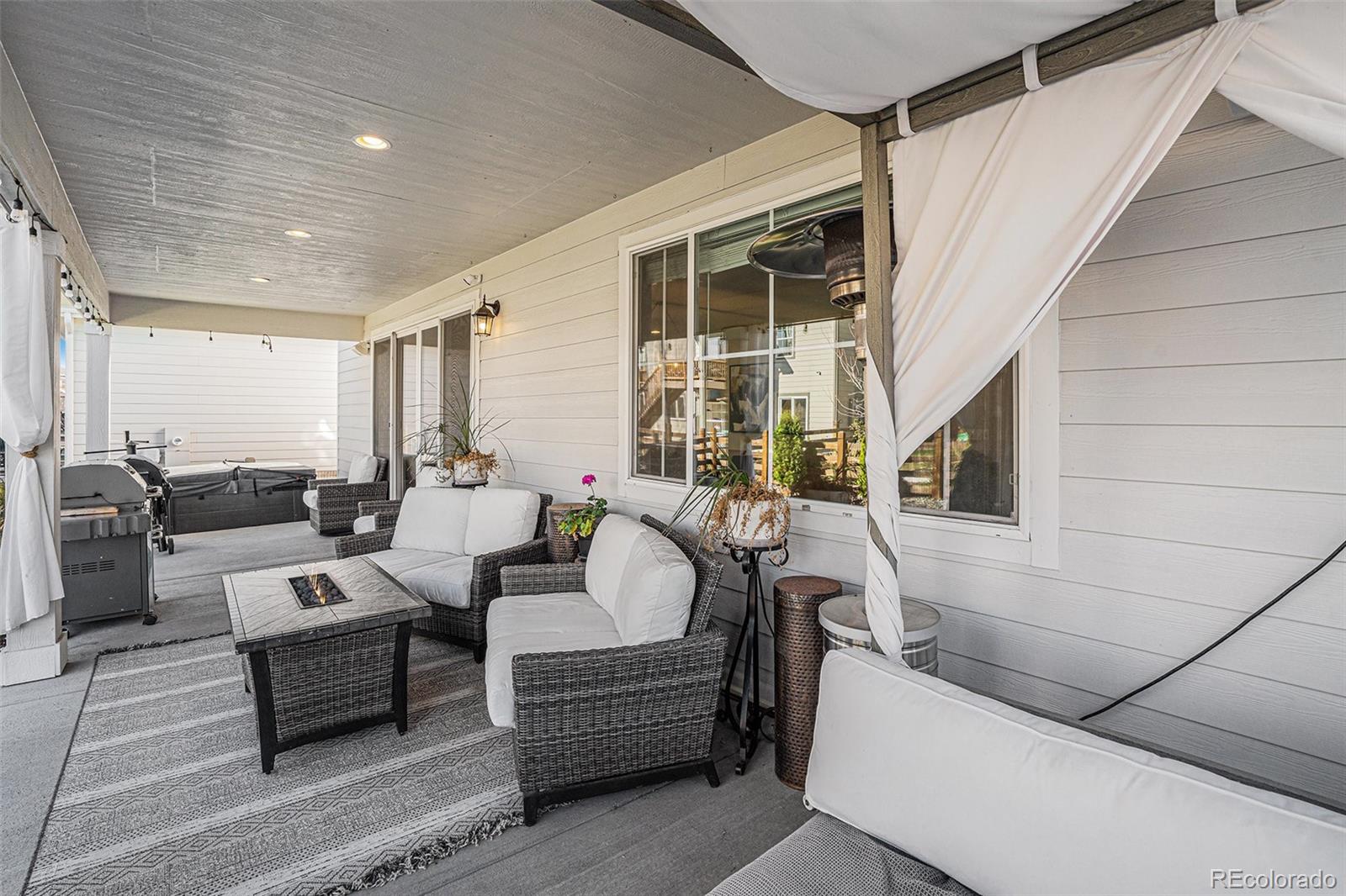 22011 East Stanford Circle Aurora, CO 80015 - Photo 37 of 43 a living room with furniture and a fireplace