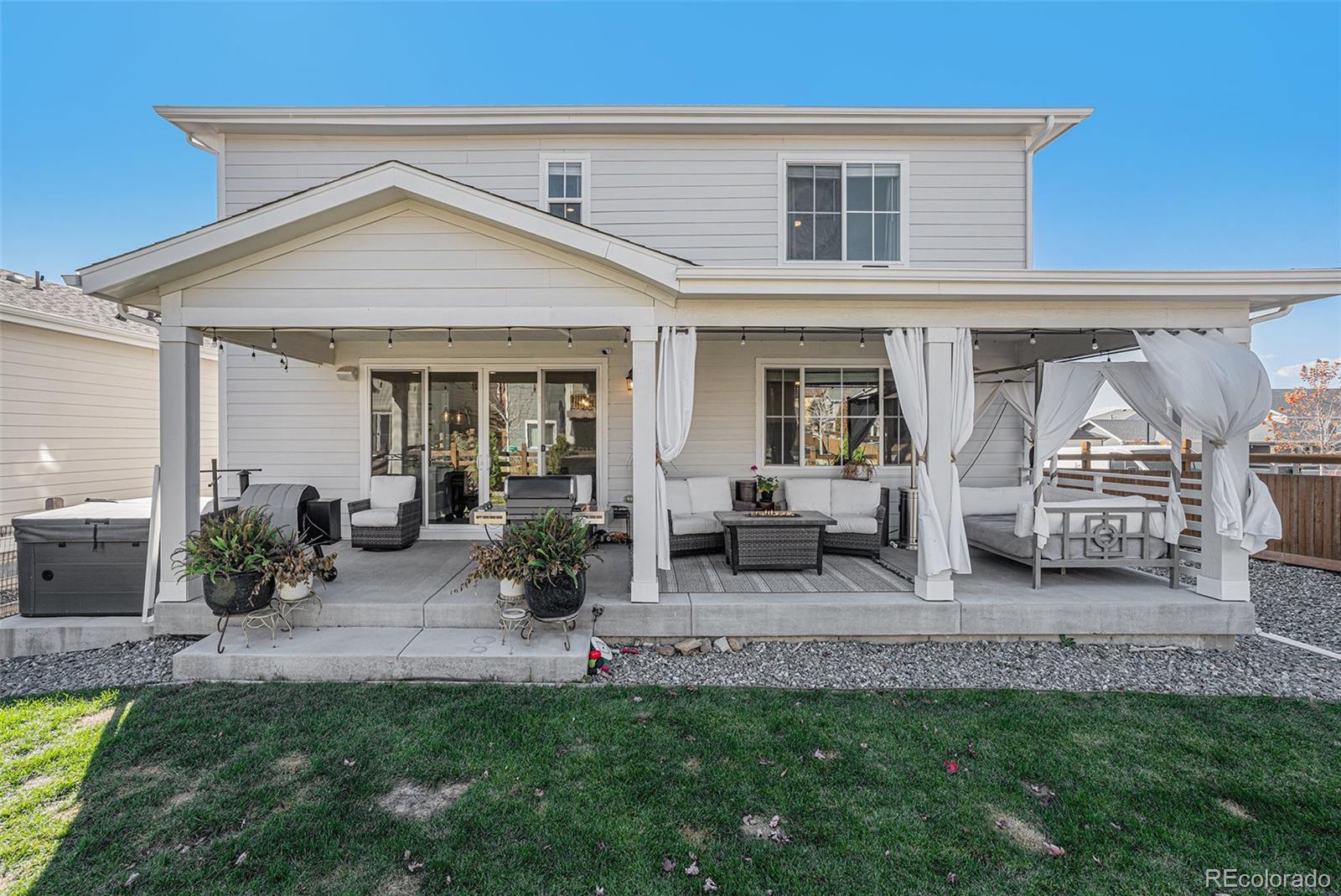 22011 East Stanford Circle Aurora, CO 80015 - Photo 38 of 43 a view of a house with backyard porch and outdoor seating
