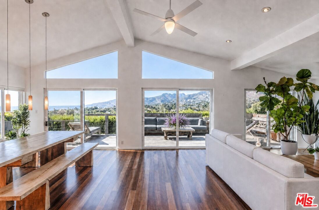 29500 Heathercliff Road, Unit 275 Malibu, CA 90265 - Photo 32 of 35 a living room with furniture and a large window
