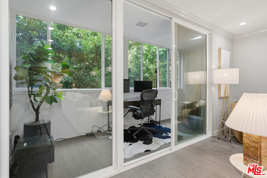 1015 North Kings Road, Unit 110 West Hollywood, CA 90069 - Photo 16 of 36 a view of a hallway and a livingroom with furniture