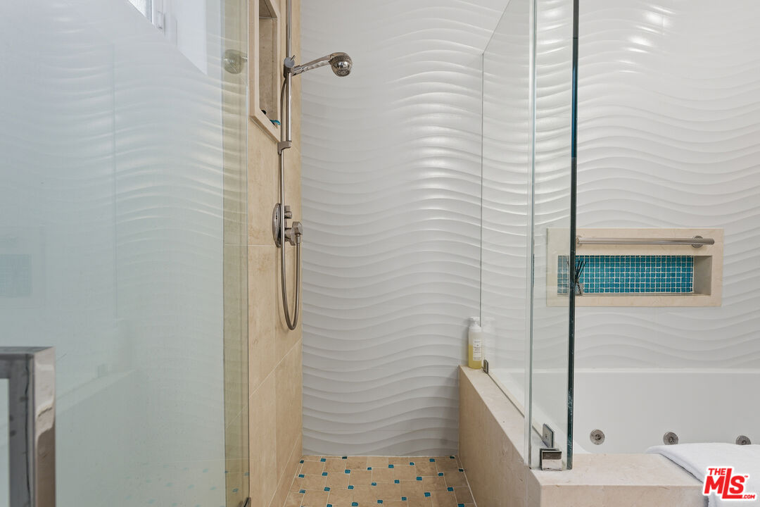 1015 North Kings Road, Unit 110 West Hollywood, CA 90069 - Photo 22 of 36 a bathroom with a shower and a tub