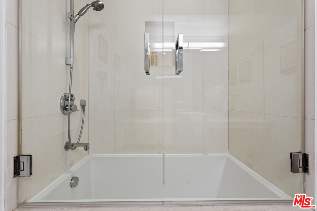1015 North Kings Road, Unit 110 West Hollywood, CA 90069 - Photo 26 of 36 a bathroom with a shower