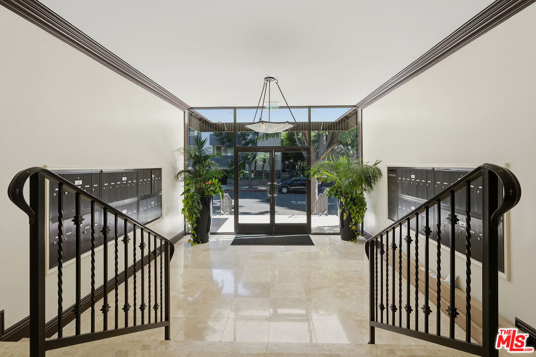 1015 North Kings Road, Unit 110 West Hollywood, CA 90069 - Photo 31 of 36 a view of staircase with lots of green space and stairs