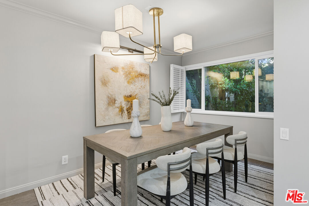 1015 North Kings Road, Unit 110 West Hollywood, CA 90069 - Photo 9 of 36 a view of a dining room with furniture window and outside view