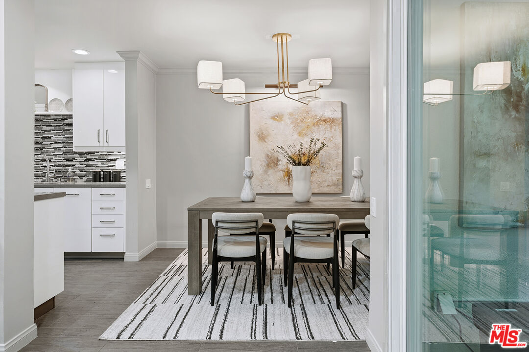 1015 North Kings Road, Unit 110 West Hollywood, CA 90069 - Photo 10 of 36 a view of a dining room with furniture