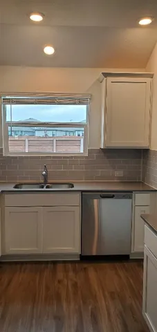 a close view of appliances and cabinets in a room