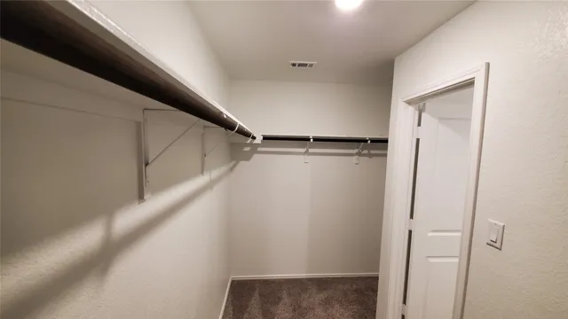 a bathroom with a double vanity sink and mirror