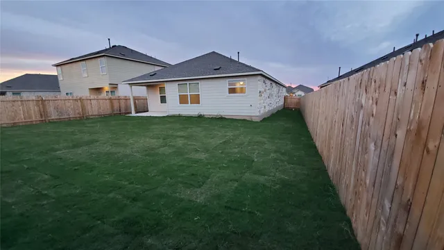 a view of a yard in front of a house with a yard