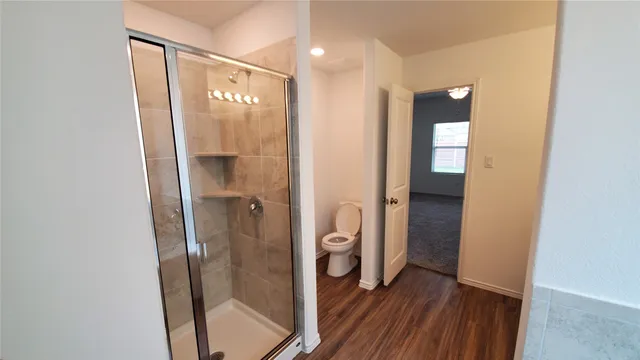 a view of a bathroom from a hallway