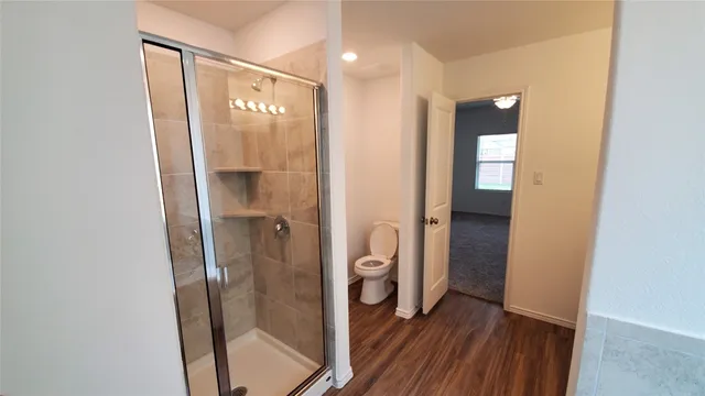 a view of a bathroom from a hallway
