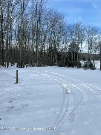 a view of white house with a yard