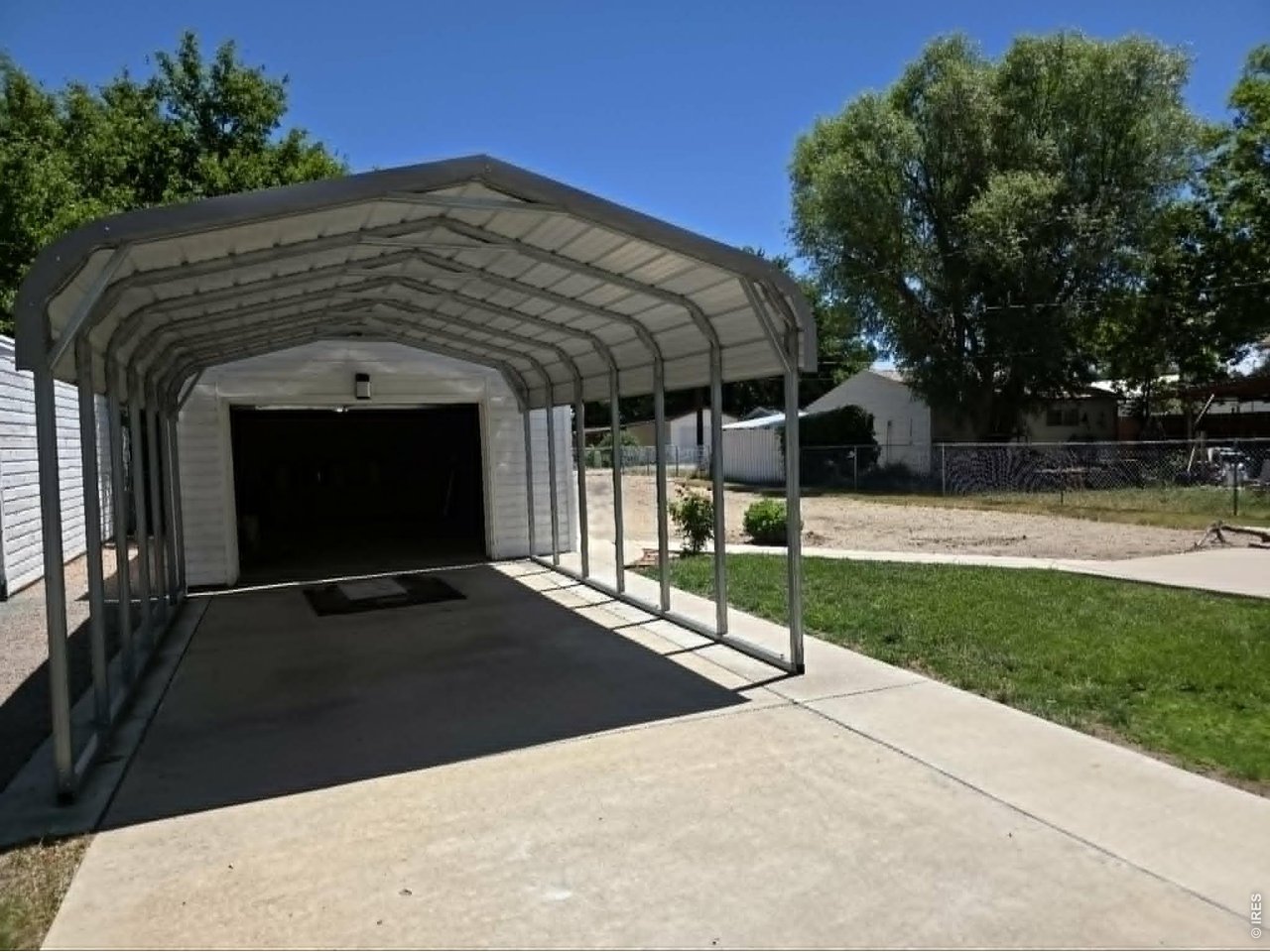 218 Maple Street Fort Morgan, CO 80701 - Photo 8 of 48 Single car garage with carport