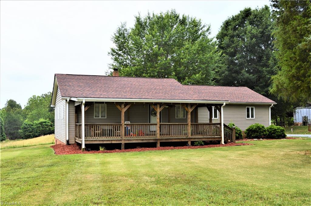 170 Baker Crossroad Road Madison, NC 27025 - Photo 2 of 30 Exterior Front View: Note amazing covered front porch, landscaping, newer roof and attached carport!