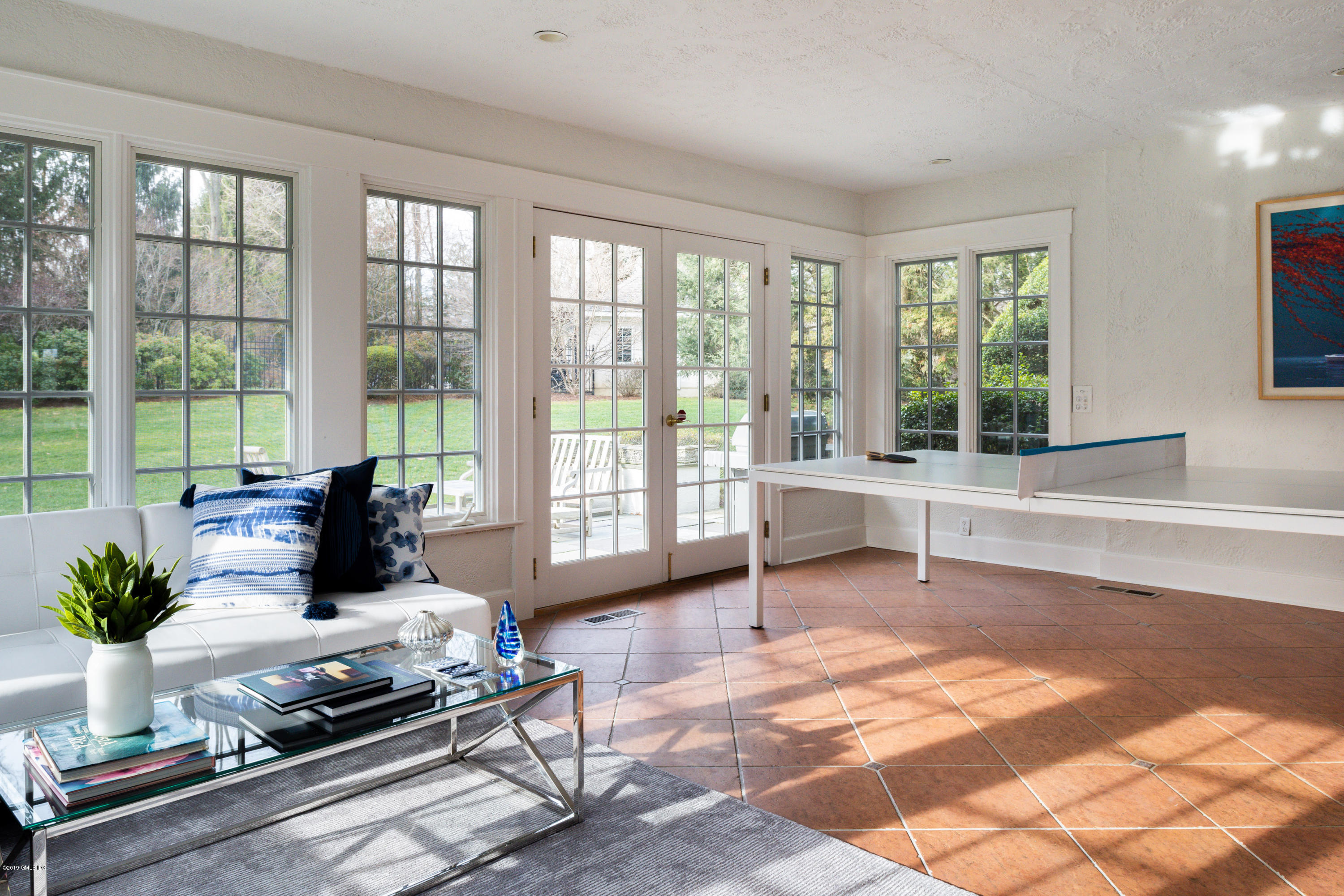 50 Upland Drive Greenwich, CT 06831 - Photo 11 of 34 a living room with furniture and large windows
