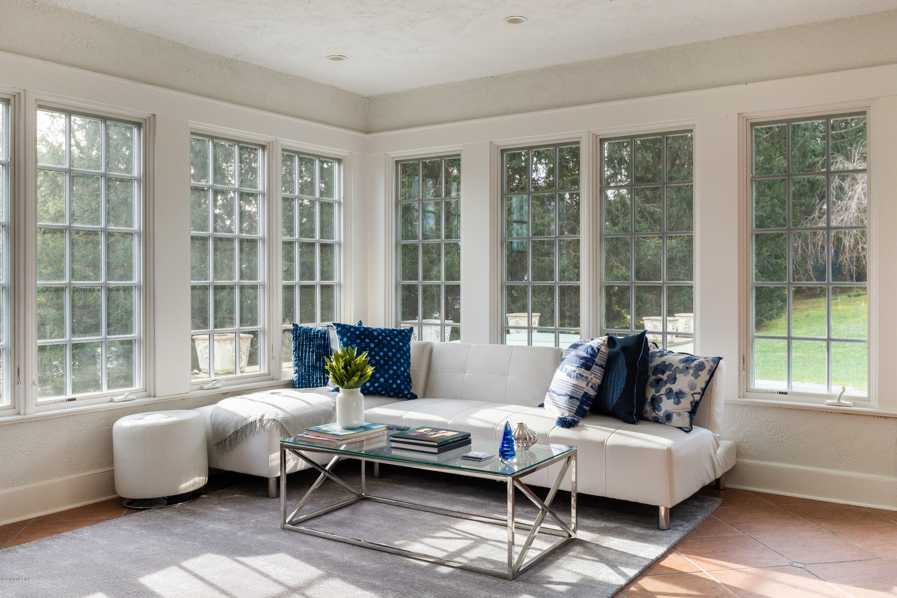 50 Upland Drive Greenwich, CT 06831 - Photo 13 of 34 a living room with furniture and large windows