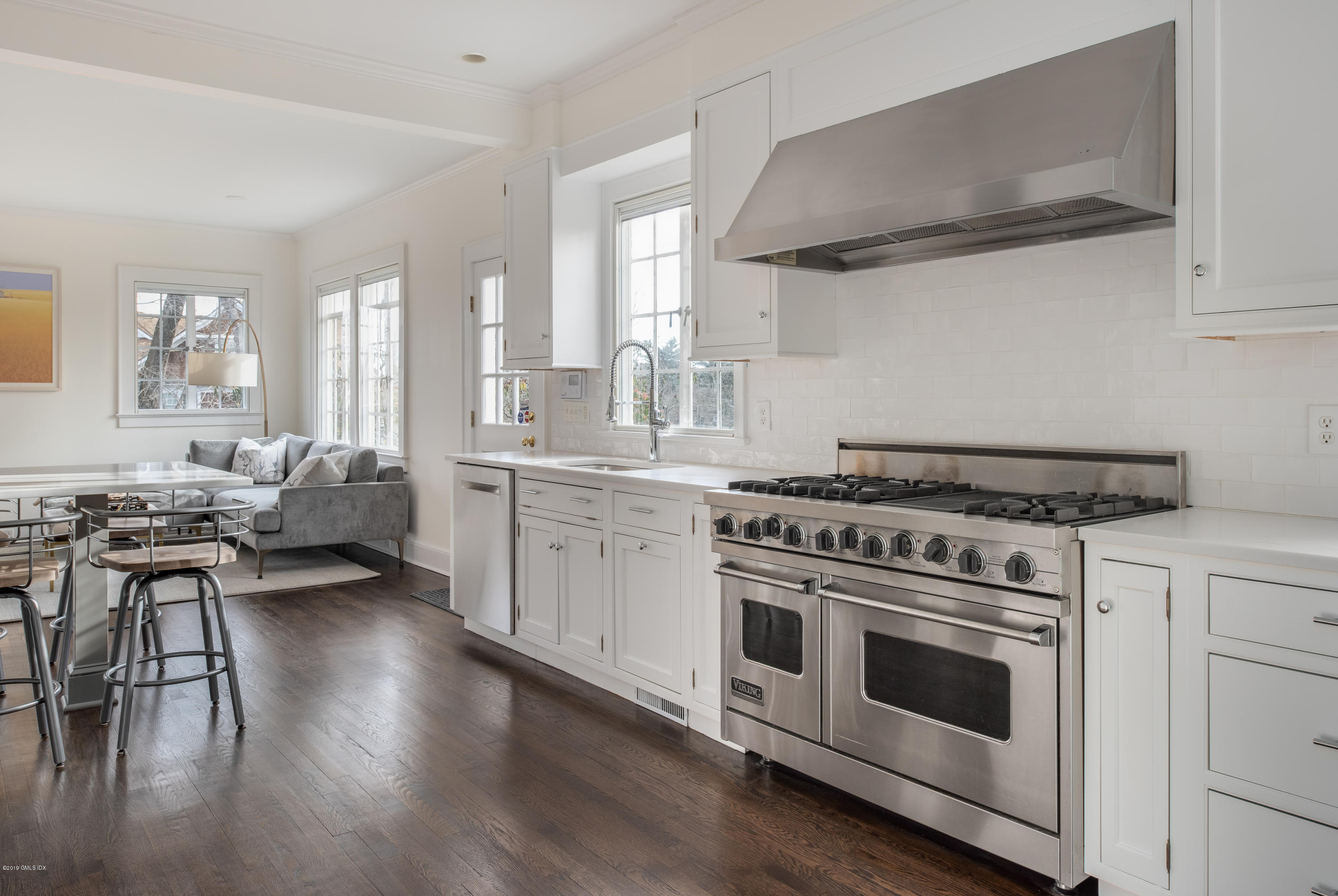 50 Upland Drive Greenwich, CT 06831 - Photo 16 of 34 a open kitchen with white cabinets stove and sink