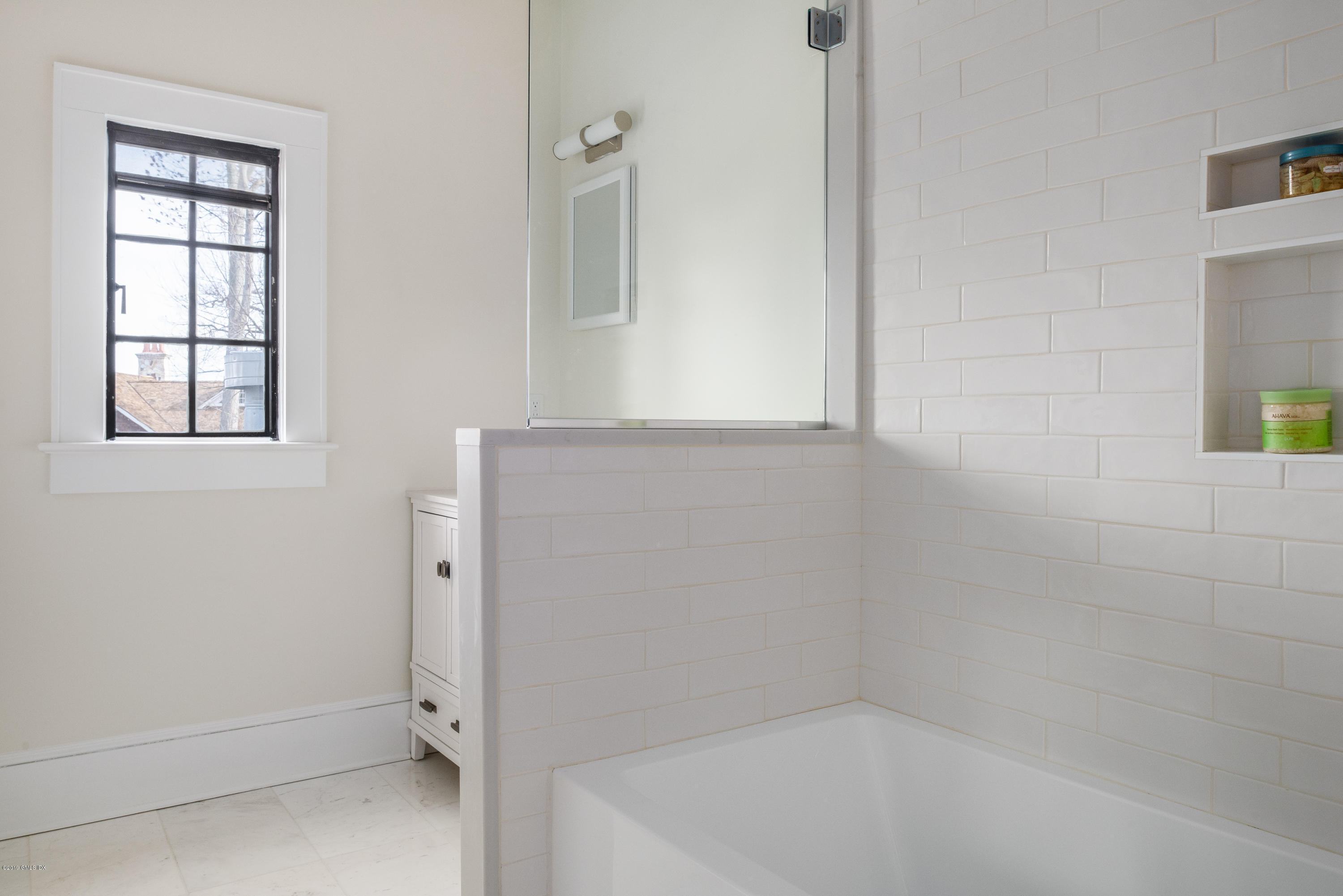50 Upland Drive Greenwich, CT 06831 - Photo 26 of 34 a bathroom with a tub and window