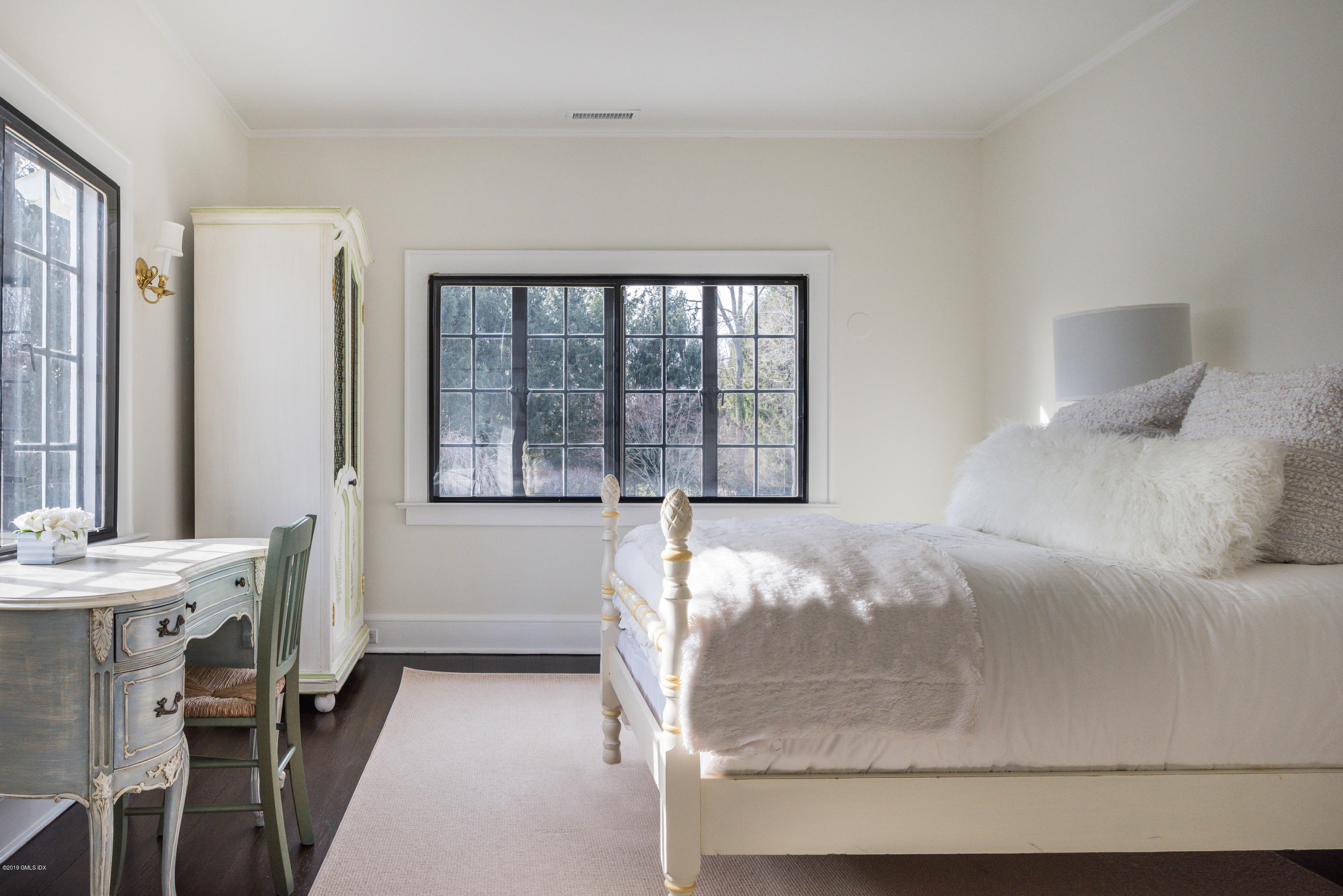 50 Upland Drive Greenwich, CT 06831 - Photo 27 of 34 a view of a bedroom with furniture and windows