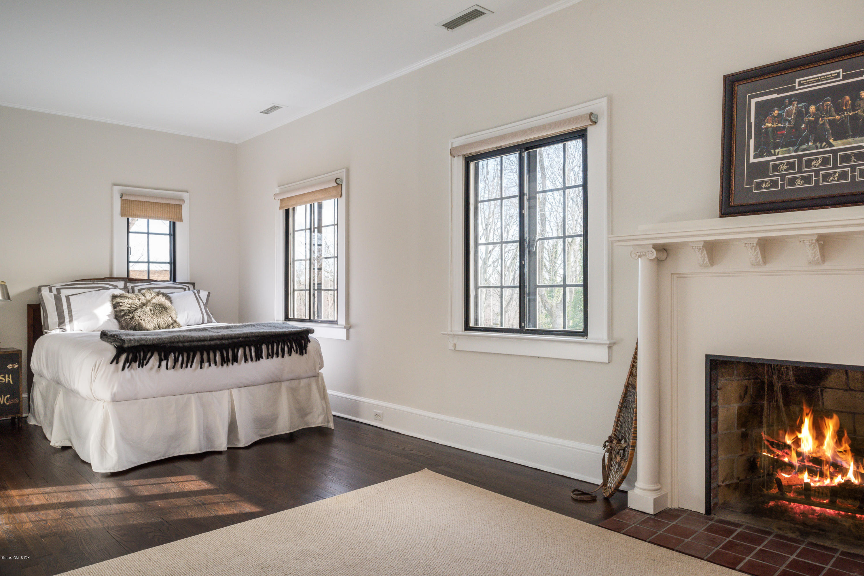 50 Upland Drive Greenwich, CT 06831 - Photo 28 of 34 a living room with furniture and a fireplace