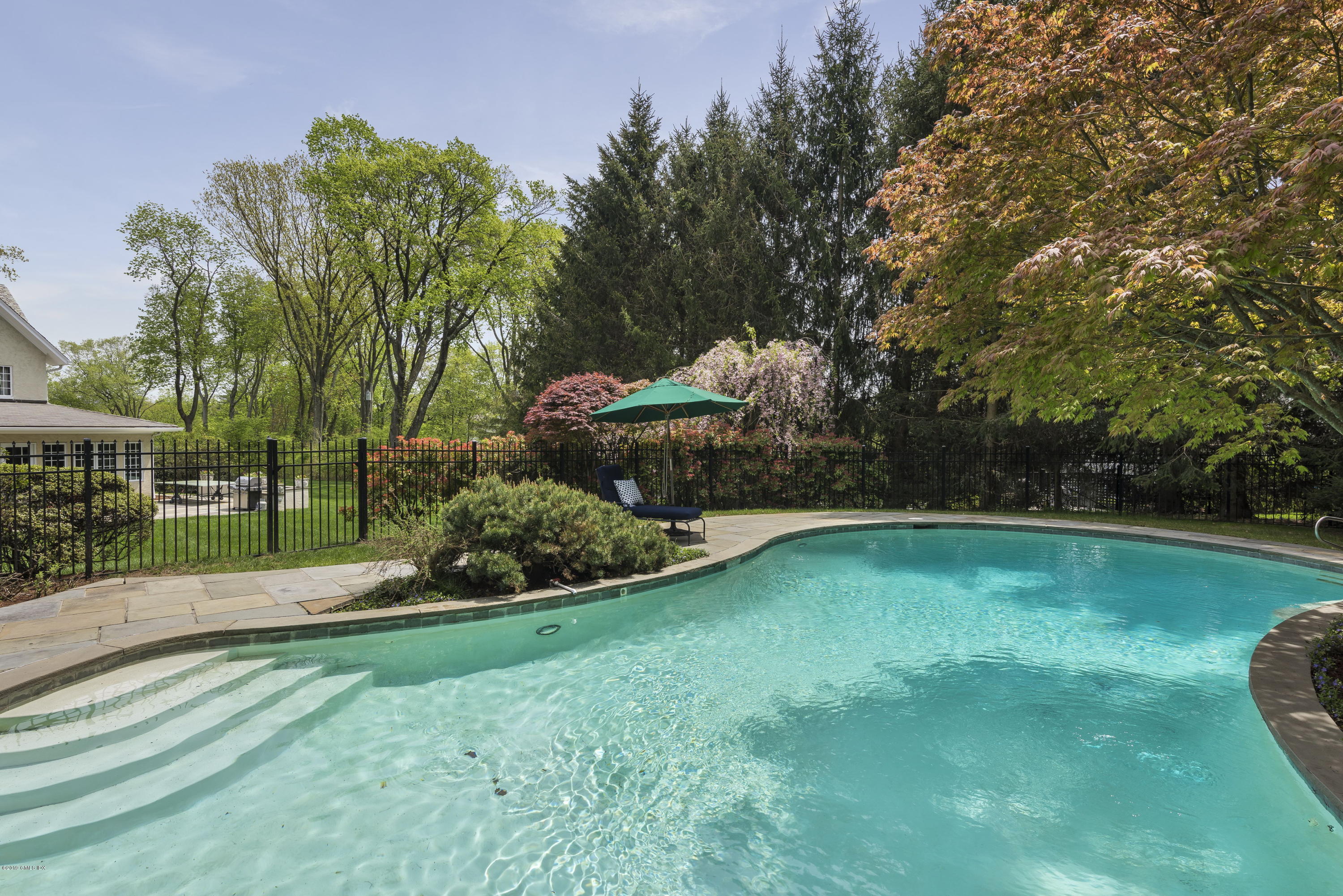50 Upland Drive Greenwich, CT 06831 - Photo 33 of 34 a view of a garden with lawn chairs