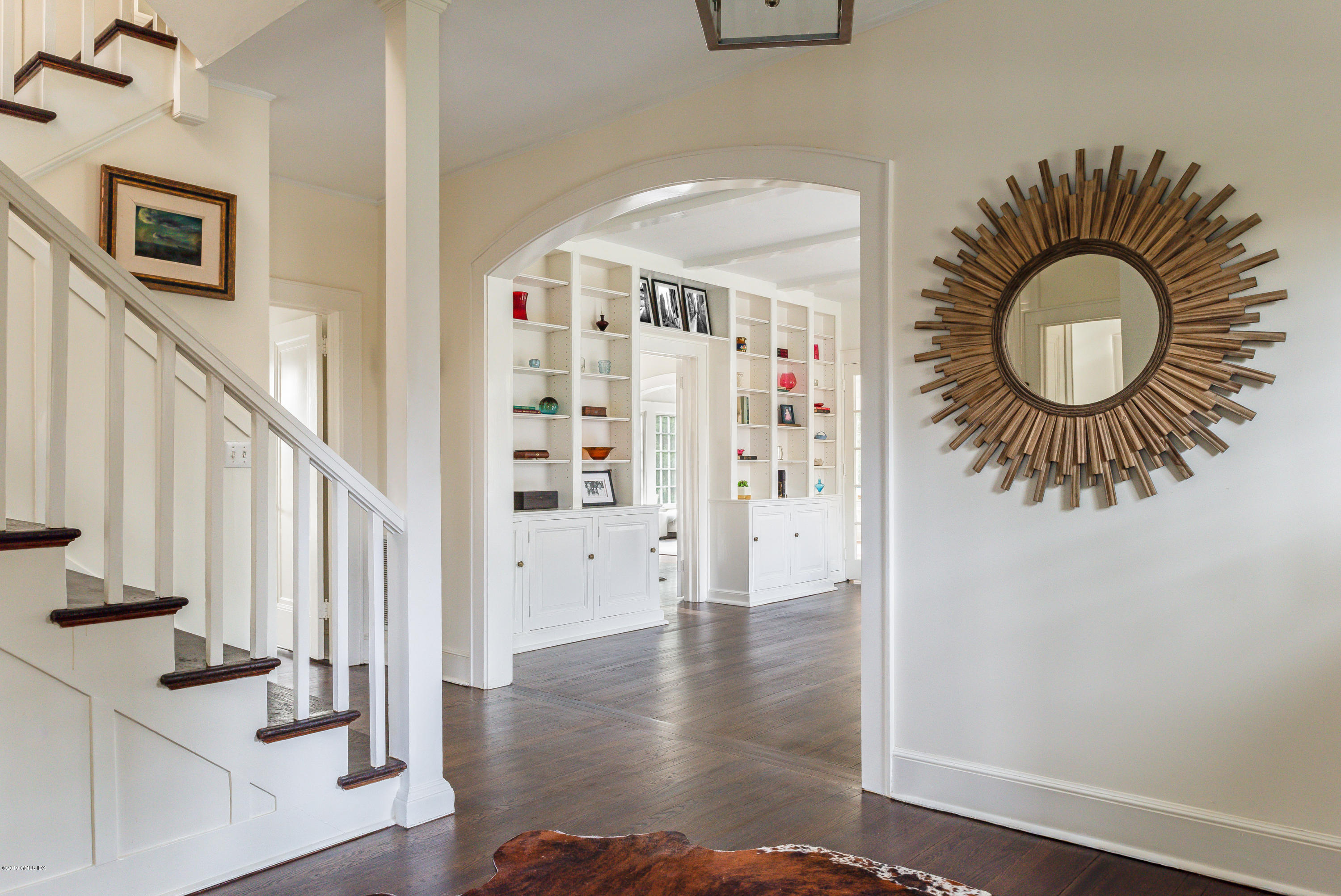 50 Upland Drive Greenwich, CT 06831 - Photo 6 of 34 a view of an entryway with wooden floor and staircase