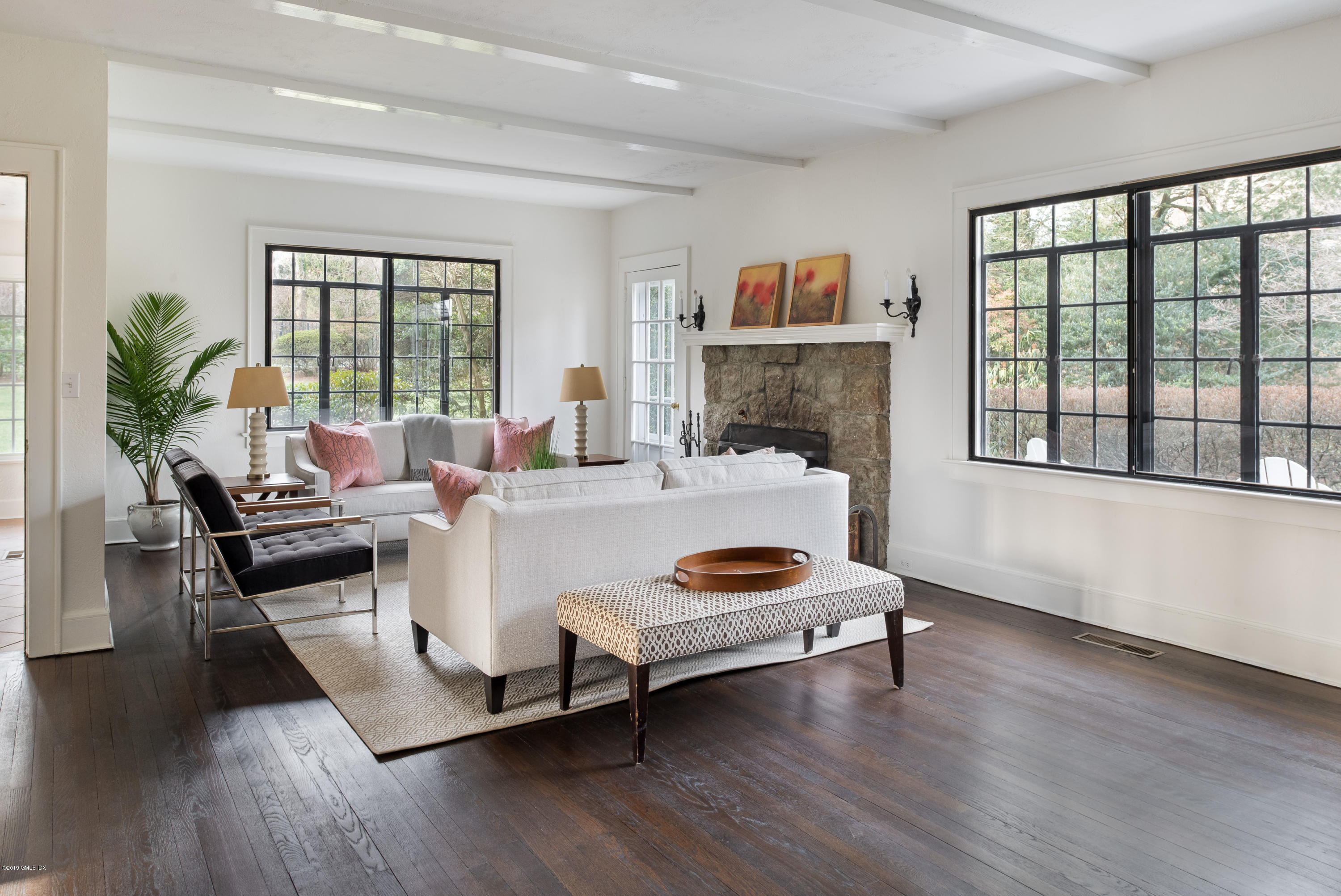 50 Upland Drive Greenwich, CT 06831 - Photo 8 of 34 a living room with furniture and a fireplace