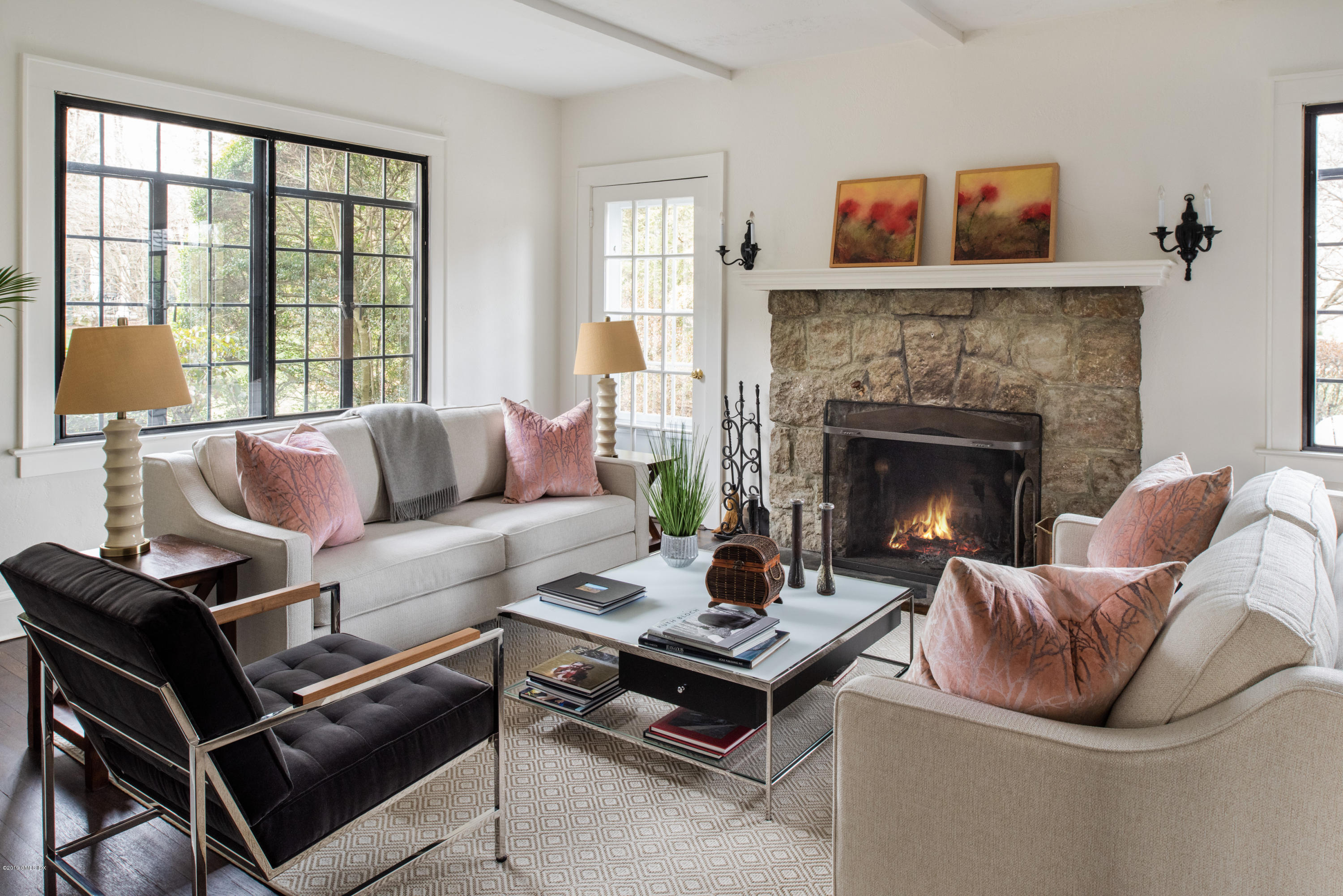50 Upland Drive Greenwich, CT 06831 - Photo 9 of 34 a living room with furniture a table and a fireplace
