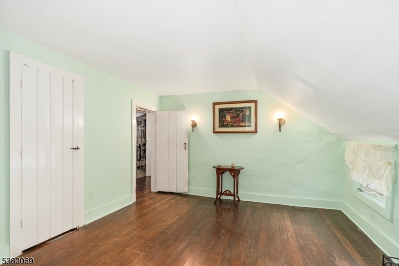 2 Bell Street Sparta, NJ 07871 - Photo 18 of 29 a view of an empty room with wooden floor and a window