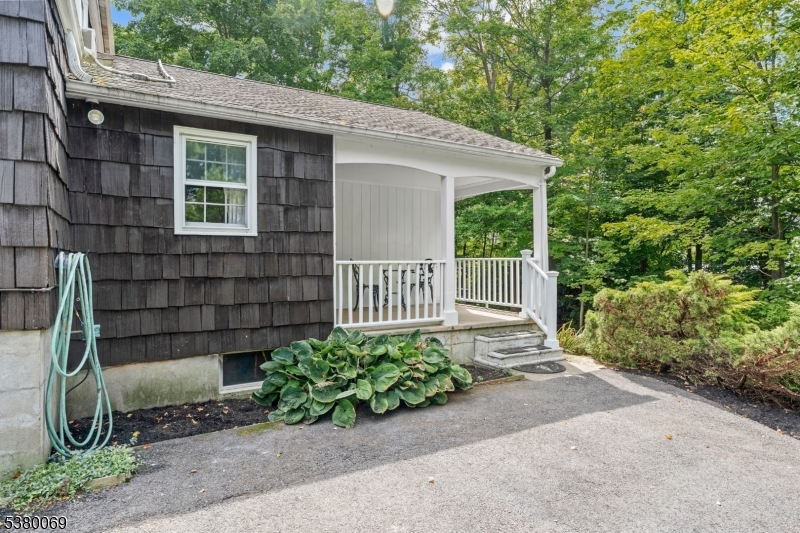 2 Bell Street Sparta, NJ 07871 - Photo 25 of 29 a view of a house with a small yard and a large window