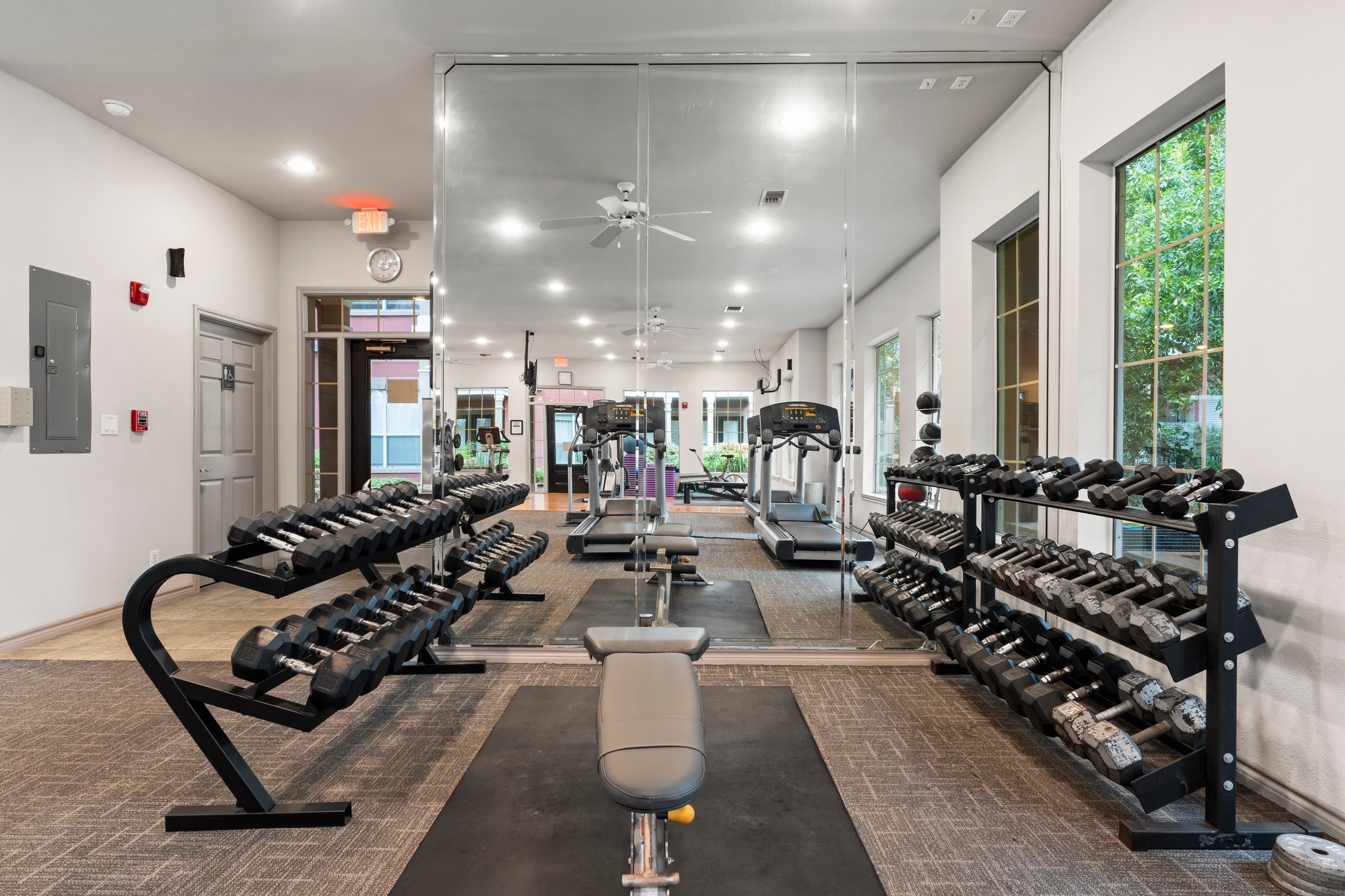 2400 McCue Road, Unit 237 Houston, TX 77056 - Photo 24 of 27 a large room with lots of chairs and a rug