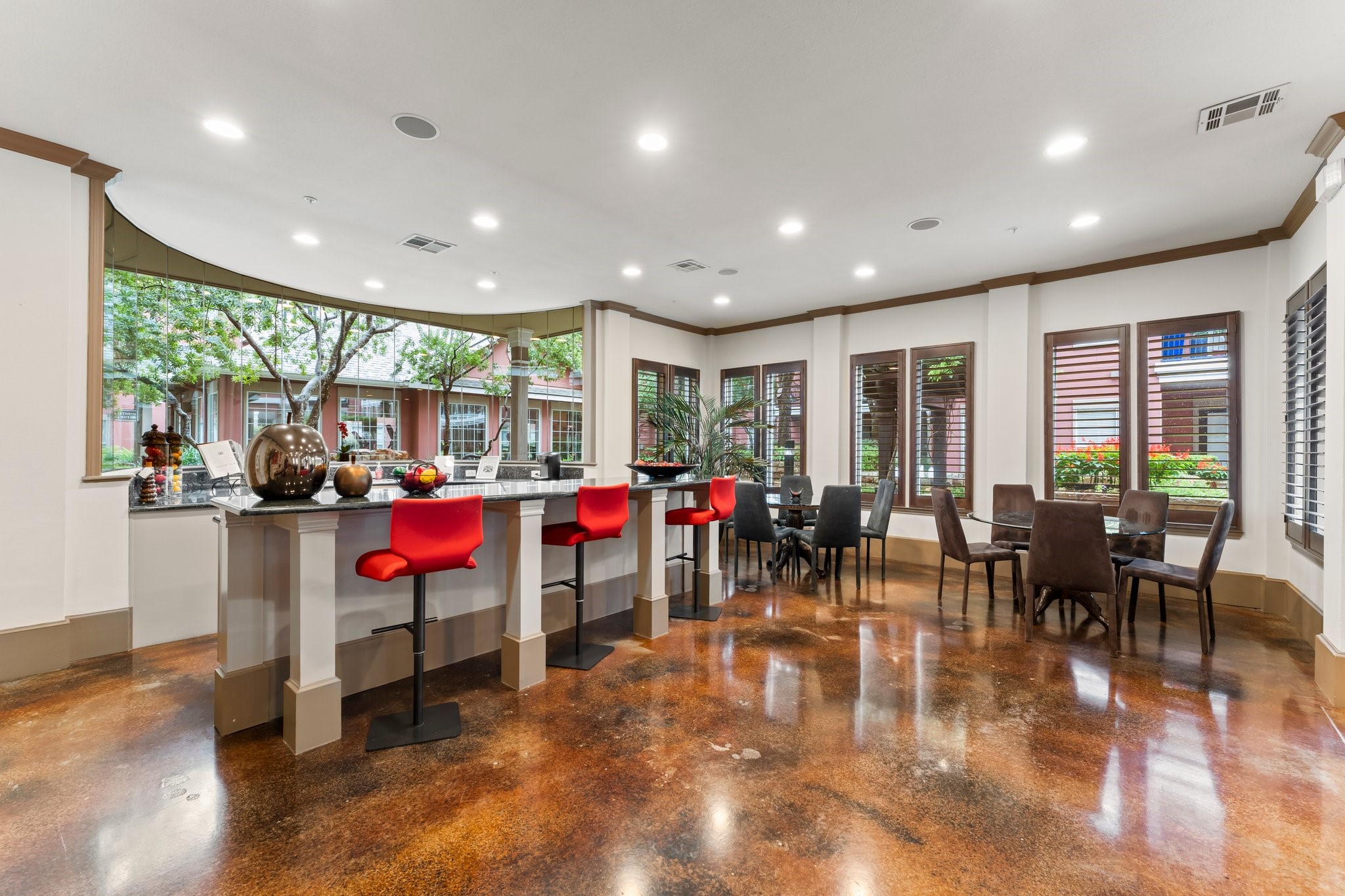 2400 McCue Road, Unit 237 Houston, TX 77056 - Photo 25 of 27 a room with lots of tables a large window and chairs