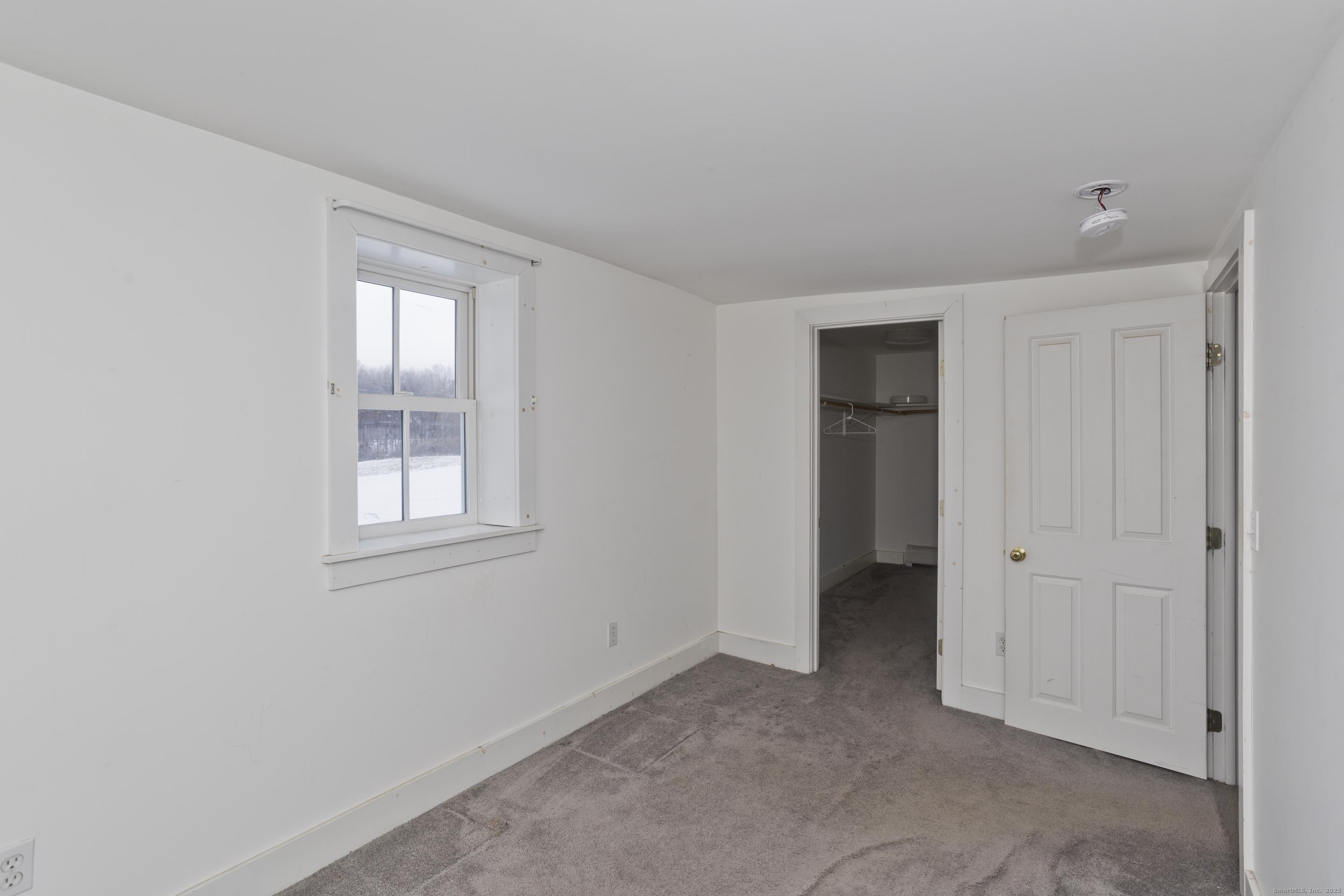 1095 South Grand Street Suffield, CT 06093 - Photo 14 of 31 an empty room with windows