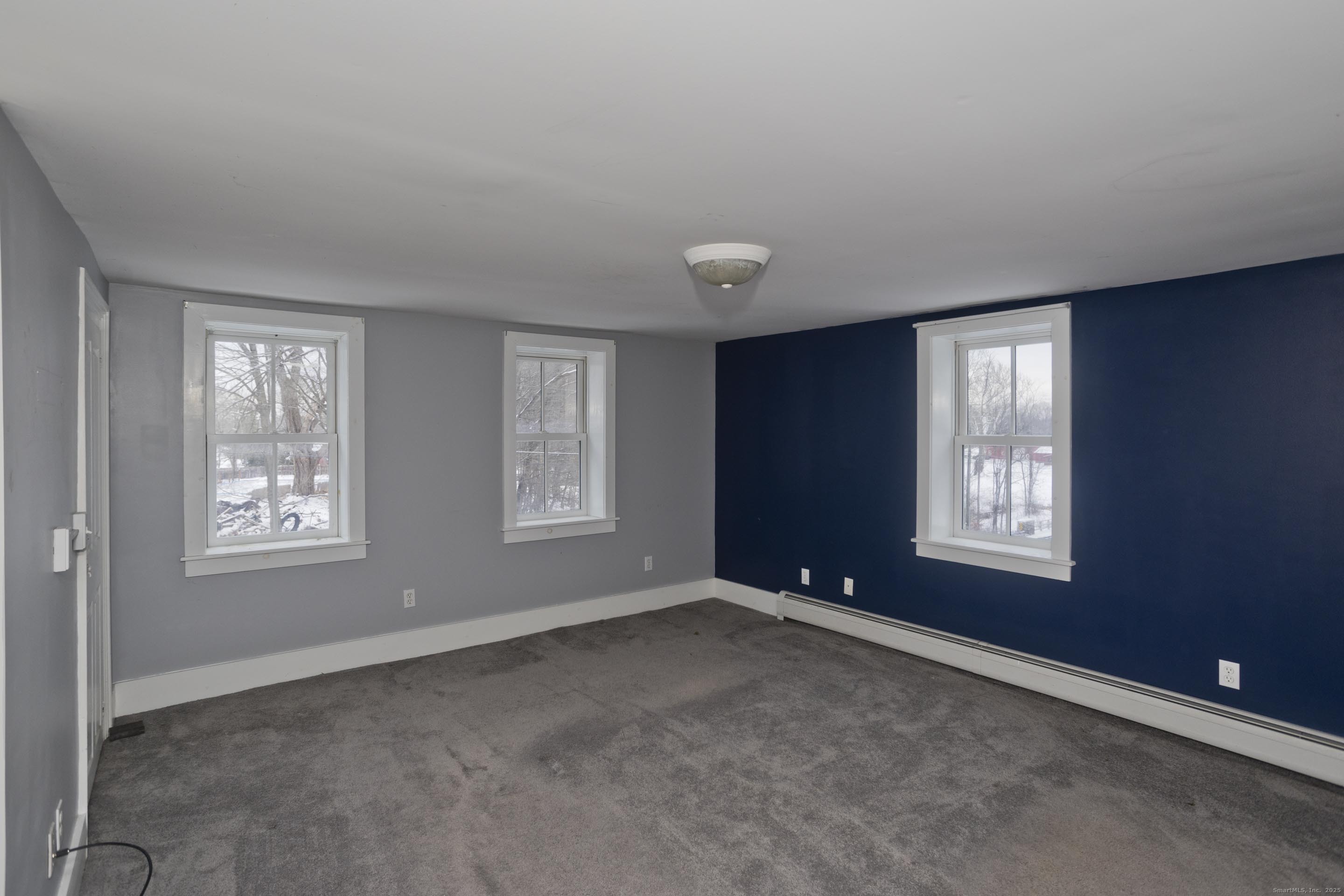 1095 South Grand Street Suffield, CT 06093 - Photo 17 of 31 a view of an empty room with a window