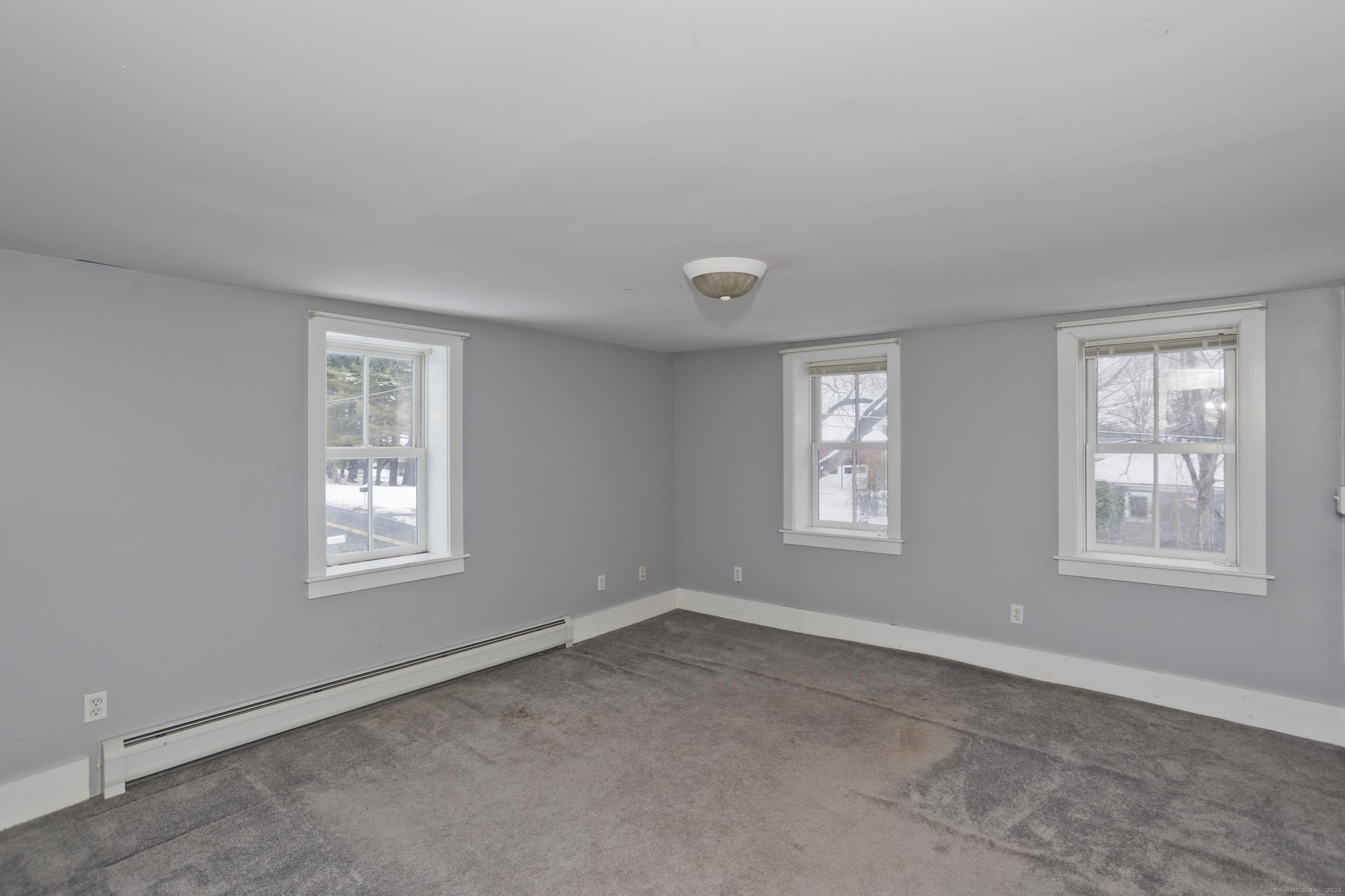 1095 South Grand Street Suffield, CT 06093 - Photo 20 of 31 an empty room with windows