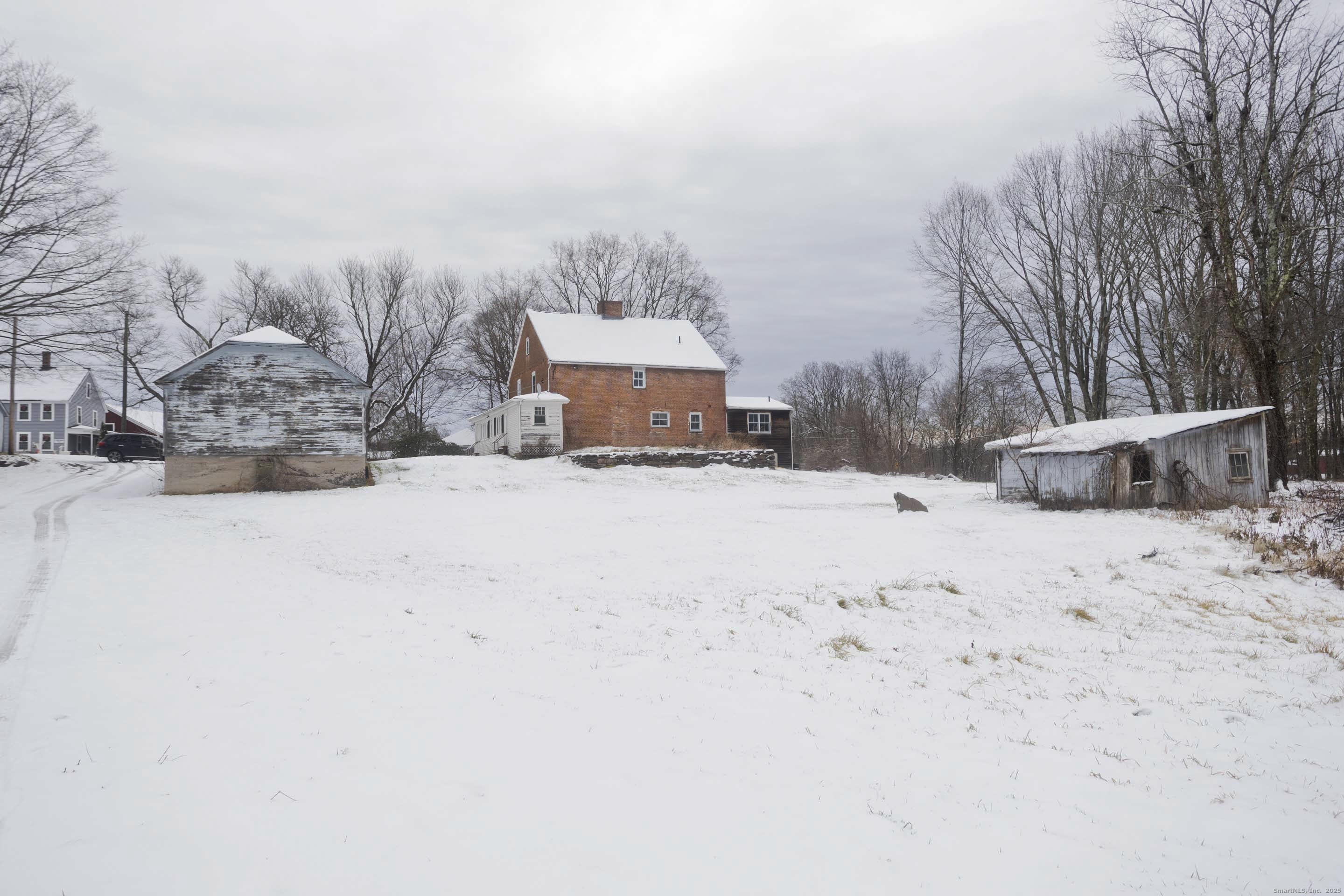 1095 South Grand Street Suffield, CT 06093 - Photo 21 of 31 a view of a dry yard covered in snow