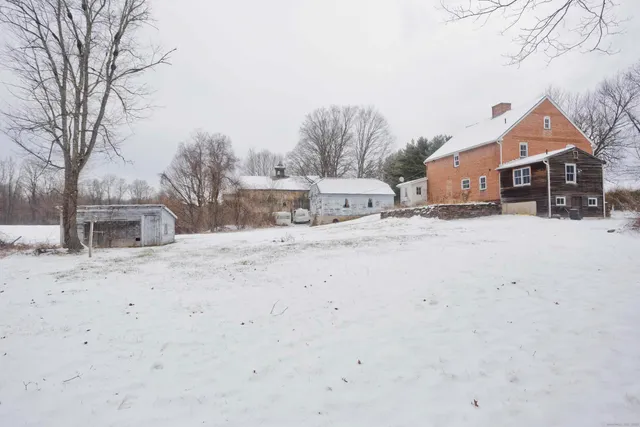 a view of a yard covered in snow